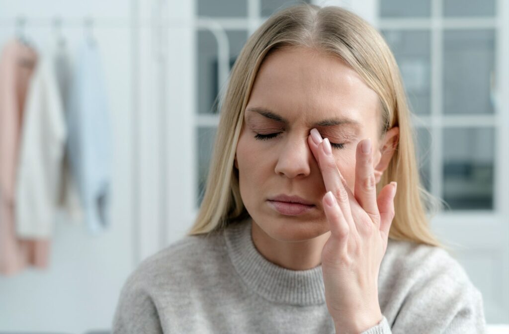 A woman experiencing dry eye symptoms