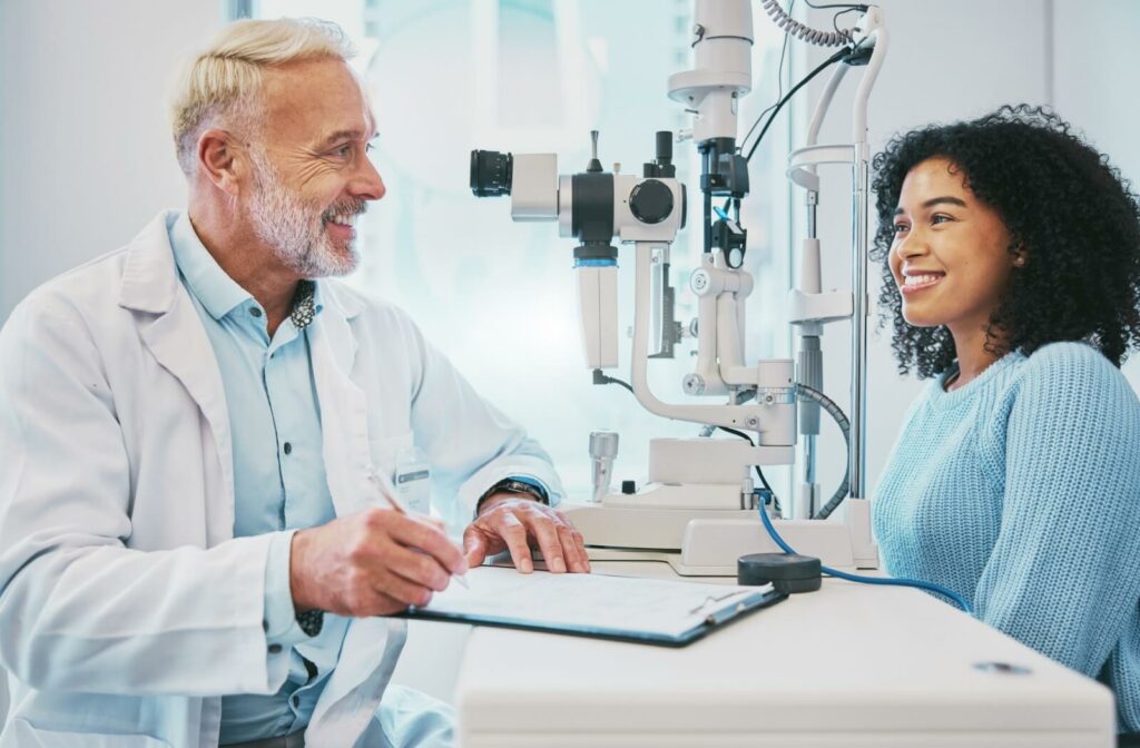 An optometrist and his patient discussing whether or not punctal plugs are right for her after an eye exam.