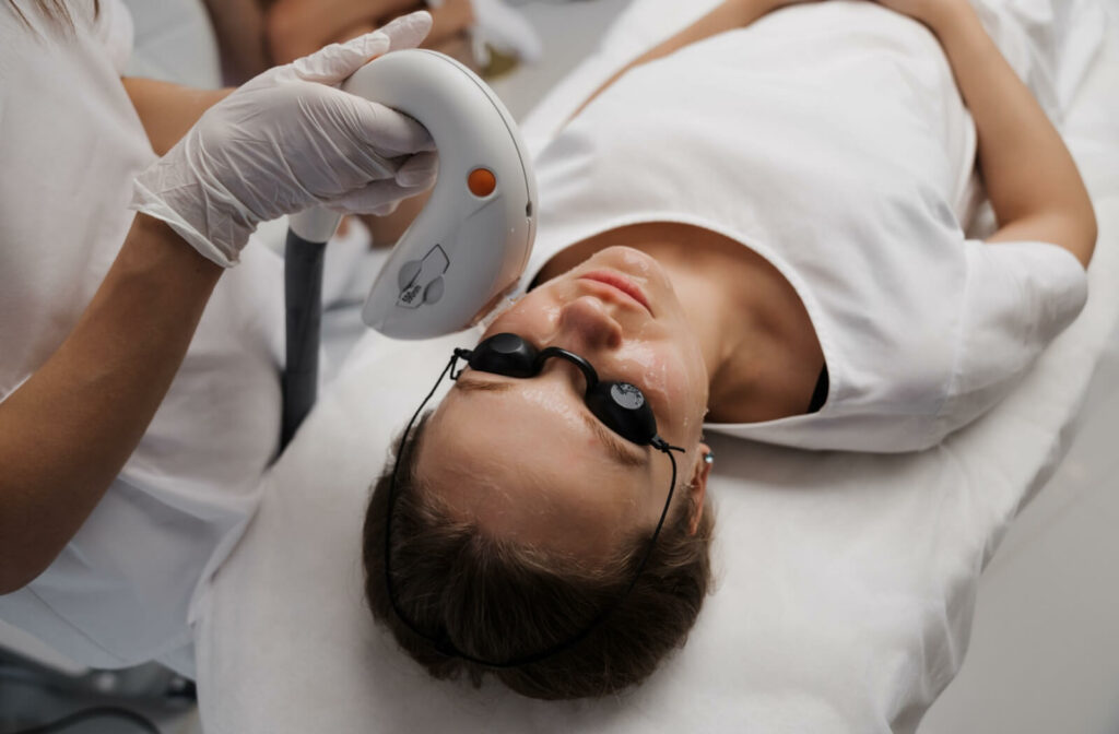 A person wears protective goggles during their IPL treatment.